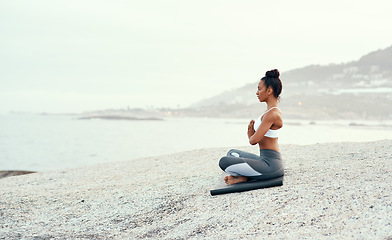 Image showing Yoga, medication and woman on a beach with lotus pose, wellness and fitness. Pilates, sea and female person on sand with peace in nature feeling relax and calm with spiritual and holistic mockup