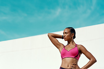 Image showing Sports, fitness and woman with blue sky, mockup at outdoor gym and focus on health and wellness. Workout, exercise and confidence, fit athlete with space and healthy mindset for summer body goals.