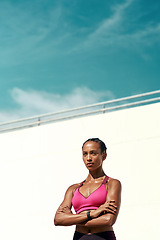 Image showing Sports, fitness and woman with arms crossed, mockup and sky at outdoor gym for health and wellness. Workout, exercise and serious athlete with focus, target and healthy mindset for fit summer goals.