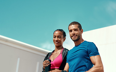 Image showing Fitness, portrait of happy woman and man with blue sky, mockup at outdoor gym for health and wellness in sports. Workout, exercise and personal trainer with athlete, smile and healthy mindset goals.