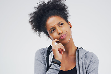 Image showing Black woman, serious and isolated thinking of fitness, workout idea or planning exercise and health goals. Girl, think or plan decision for training, gym or remember sport ideas on white background