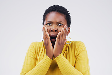 Image showing Shock, scared and portrait of woman in a studio with a omg, wow or wtf facial expression for emotion. Fear, afraid and African female model with horror face for bad news isolated by white background.