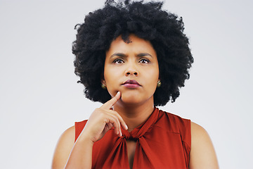 Image showing Thinking, frown and woman in studio with anxiety, decision and choice on grey background space. Doubt, suspicious and African female person with worry, stress or fear, contemplating or confused emoji