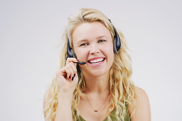 Image showing Call center, woman and smile in studio portrait with headset, listening and tech support by white background. Female agent, telemarketing and customer service with mic, voip and happy for consulting