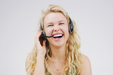 Image showing Call center, woman and laugh in studio portrait with headset, smile and excited for tech support by backdrop. Funny agent, telemarketing and customer service with mic, voip and happy for consulting