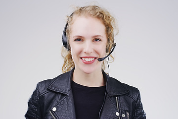 Image showing Call center, woman and studio portrait with headset, smile and microphone for tech support by background. Crm agent, telemarketing and customer service with mic, voip and happy for consulting job