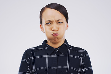 Image showing Portrait, funny face and breath with a woman in studio on a gray background looking silly or goofy. Comedy, comic and frown with a crazy young female person joking indoor for quirky fun or humor