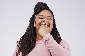 Image showing Portrait, funny face and finger on nose with a black woman in studio on a gray background looking silly or goofy. Comedy, comic and nostril with a crazy young female person joking for fun or humor