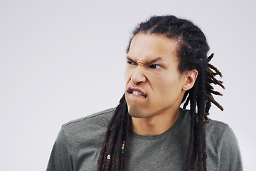 Image showing Man, funny face and goofy expression on mockup space against a white studio background. Young male person or model with silly faces and braids for comedy, comic or crazy mood and strange attitude