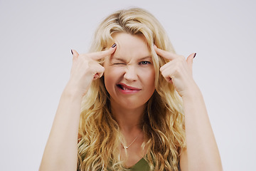 Image showing Portrait, funny face and fingers on head with a woman in studio on a gray background looking silly or goofy. Comedy, comic and mental with a crazy young female person joking for fun or playful humor