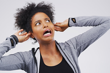 Image showing Surprise, funny face and ears with an african woman in studio on a gray background looking silly or goofy. Comedy, comic and shock with a crazy young female person in awe of hearing news while joking