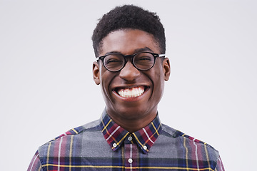 Image showing Portrait, mockup and black man with a smile, funny and confident against a grey studio background. Face, male person and model with facial expression, humor and geek laughing, comic and happiness