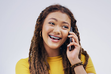 Image showing Phone call, funny and woman talking in studio isolated on a white background. Cellphone, laughing and African female person in communication, speaking or discussion, comedy or comic, meme and excited