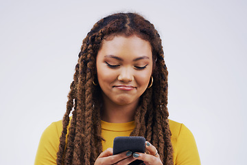 Image showing Phone, typing and face of woman in studio with smile for social media, internet and online chat. Communication, white background and female person on smartphone for website, mobile app and texting