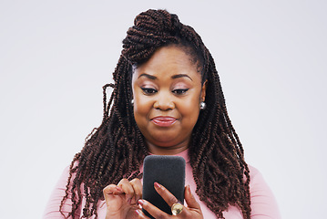 Image showing Communication, online and face of black woman with phone in studio for social media, internet and chat. Mockup, white background and female person on smartphone for website, mobile app and texting