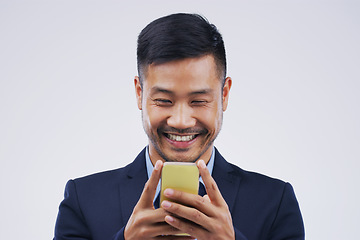 Image showing Smile, phone and Asian business man in studio isolated on white background. Happy, cellphone and male person typing for email, web scroll or browsing online, social media or internet app for texting.