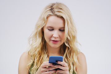 Image showing Phone, social media and woman in studio typing message, browse internet and online chat. Communication mockup, white background and female person on smartphone for website, mobile app and networking