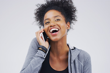 Image showing Phone call, funny and black woman speaking in studio isolated on a white background with mockup. Cellphone, laughing and African female person in communication, happy conversation and comic comedy.