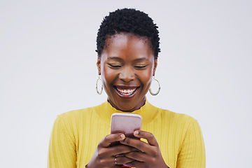 Image showing Social media, black woman on smartphone and smile against a white background. Connectivity or technology, communication or texting and African female person happy with cellphone in a studio backdrop