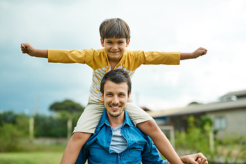 Image showing Portrait, kids and a son on back of his dad outdoor in the garden to fly like an airplane while bonding together. Family, children and a father carrying his boy child while playing a game in the yard