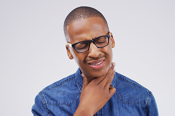 Image showing Black man, sore throat and virus in pain, allergies or bacteria against a white studio background. Sick African male person touching neck from cough, allergy or flu of cold, illness or infection