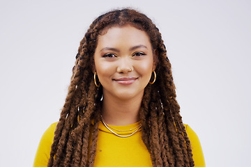 Image showing Portrait, happy and braids with a black woman in studio on a gray background for beauty or fashion. Face, smile and style with an attractive young female person feeling confident in trendy clothes