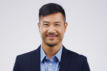 Image showing Portrait, entrepreneur and Asian man with a corporate career and confident agent against a white studio background. Face, male person and lawyer in a suit, professional and employee with happiness