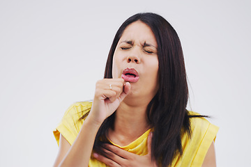 Image showing Woman, cough and studio with virus, sick or covid 19 with breathing problem by background. Girl, allergies or tuberculosis with struggle to breathe, asthma and pain in lungs with healthcare challenge