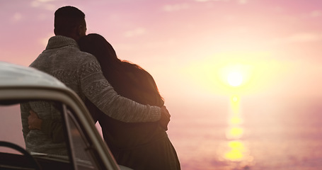 Image showing Couple, hug and sunset sky at beach with love on vacation, holiday or adventure. A man and woman on a road trip for marriage, travel journey or date outdoor in nature with freedom and mockup space