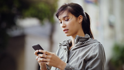 Image showing Woman, smartphone and social media in the city with communication and technology outdoor. Female person online in urban street, connectivity and chat on mobile app with mockup space and texting