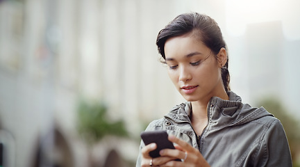 Image showing Woman, using phone and social media in the city with communication and technology outdoor. Female person online in urban street, connectivity and chat on mobile app with mockup space and texting