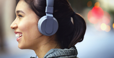 Image showing Woman with headphones in city, profile and listening to music, freedom and happy with technology outdoor. Mockup space, podcast or radio streaming, female person in urban street and audio playlist