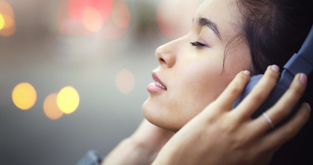 Image showing Woman with headphones in city, peace and listening to music, freedom and technology outdoor. Mockup space, podcast or radio streaming with satisfied female person in urban street and audio playlist