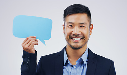 Image showing Happy asian man, portrait and speech bubble for social media, question or FAQ with smile against a white studio background. Excited male person smiling with sign for comment, message or mockup space