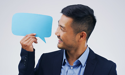 Image showing Asian business man, speech bubble and studio with smile, opinion or social media with by background. Businessman, poster or paper sign for vote, review or mockup with happiness for idea, news or chat