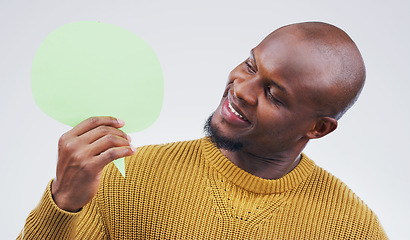 Image showing African man, speech bubble and studio with idea, smile and opinion for social media by background. Gen z guy, poster or paper sign for vote, review and mock up with happiness for ideas, news or chat