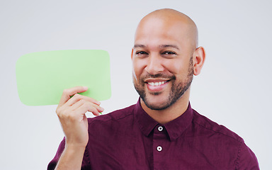 Image showing Happy man, portrait and smile with speech bubble for question, social media or FAQ against white studio background. Male person smiling with shape, symbol or sign for comment, message or mockup space