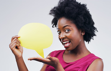 Image showing Happy black woman, portrait and speech bubble for social media, surprise or question against a white studio background. African female person with afro or sign for comment or FAQ on mockup space