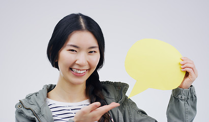 Image showing Happy asian woman, portrait smile and speech bubble for question, FAQ or social media against a white studio background. Excited female person smiling with sign for comment, message or mockup space