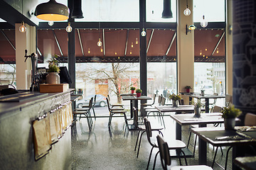 Image showing Empty restaurant, cafe store or coffee shop for retail services, hospitality industry or food sales service. Interior design, diner and startup small business with furniture, chairs and table desk