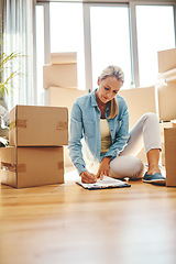 Image showing Woman, boxes and sign paperwork in the living room for investment with a contract. Investing, document and writing on the floor with a lease at a new home for retirement and finance for savings.