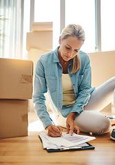 Image showing Paperwork, boxes and woman on the floor in apartment for growth on investment in mortgage. New house, document and sign for lease agreement for home insurance in title and for savings and finance.