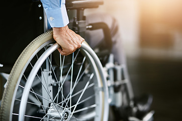 Image showing Wheelchair, care and man hand holding wheel in a hospital for healthcare. Person with disability, mobility and male adult in clinic for support and medical help with hands of patient and mockup