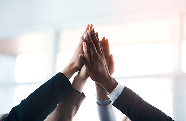 Image showing High five, colleagues and their hands together for their achievement with lens flare. Collaboration or team, group of businesspeople for support and friends with hand for cooperation or goal