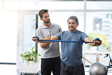 Image showing Physiotherapy, training and band with old man and doctor for stretching, rehabilitation and injury. Medical, healing and healthcare with physiotherapist and patient for consulting, help and fitness