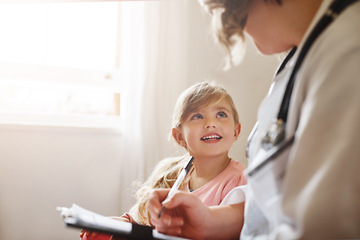 Image showing Child, family doctor and pediatrician talking with medical checklist in hospital for wellness. Happiness, clinic consultant and professional with healthcare and kids appointment with consulting form