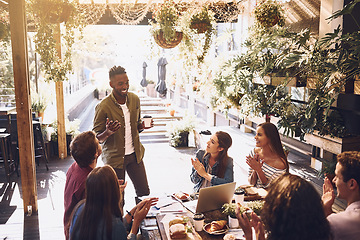 Image showing Restaurant, business people and black man in meeting applause for discussion, planning and communication. Cafe, staff lunch and men and women clapping hands for team building, collaboration and ideas