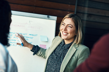 Image showing Presentation whiteboard, audience and happy woman planning, coaching and present strategy, ideas or office plan. Sales workshop, project management and team leader, boss or person speaking to group