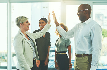 Image showing High five, winner and motivation with business people in office for success, happy and agreement. Support, goals and target with group of employees for teamwork, celebration and solidarity