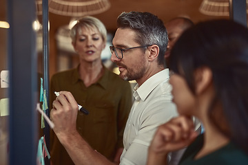 Image showing Businessman, team and writing in planning schedule for brainstorming, collaboration or strategy meeting at office. Man employee in leadership, presentation or training staff in teamwork for project